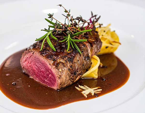 Venison loin with parsnip silk and cacao nib jus